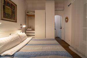a bedroom with two beds in a room at The Luxury Roma Amor in Rome