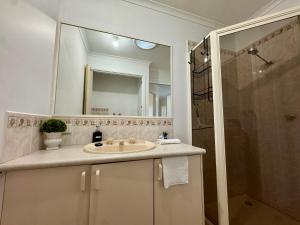 a bathroom with a sink and a shower at Private Farmhouse & Paddock Available in Werribee South