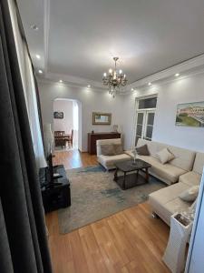 a living room with a couch and a table at Apartment 9 in Mtskheta