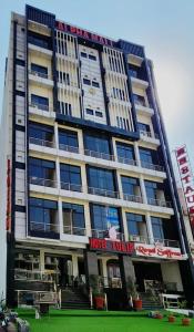 a building with a sign on the front of it at Tulip Capital Hotel in Islamabad