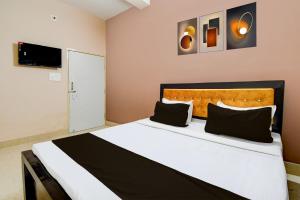 Ένα ή περισσότερα κρεβάτια σε δωμάτιο στο Hotel O SWAIN RESIDENCY +21 φωτογραφίες