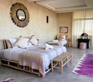 Postel nebo postele na pokoji v ubytování Dar Mimosa