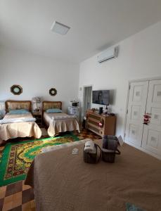 Postel nebo postele na pokoji v ubytování Loft de Mérilen - Dentro do Palácio Quitandinha + 87 fotografií