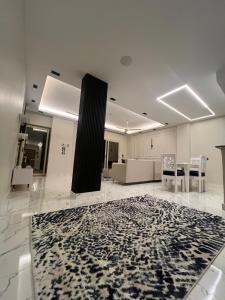 a living room with a black and white rug on the floor at ElMena House Luxor in Luxor