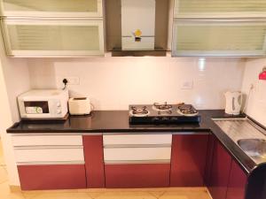 Kuchyň nebo kuchyňský kout v ubytování Heritage Exotica Villa 3BHK JAQK Holidays