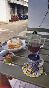 a table with a plate of food and a cup of tea at Cong Sen Backpackers Hostel in Taitung City +27 photos