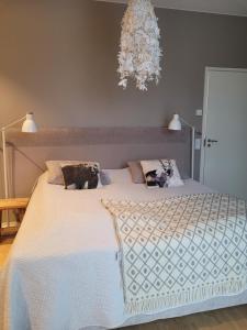 Ένα ή περισσότερα κρεβάτια σε δωμάτιο στο Villa Pinewoods