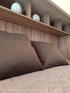 Postel nebo postele na pokoji v ubytování Residenza dentro le mura - 6 min walk to Bernina Express + 4 fotografie