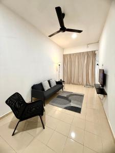 a living room with a couch and a ceiling fan at 7 STAY#3 - 1 Room for 2 Pax at Kuala Berang -Best Travelers Stay in Kuala Berang