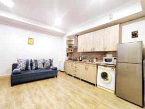 a living room with a couch in a kitchen at Jermuk Mini Apartment in Jermuk