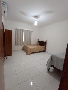 Postel nebo postele na pokoji v ubytování Beach House Guriri - Casa de temporada + 26 fotografií