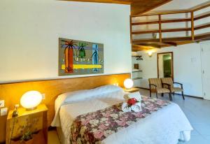 Ένα ή περισσότερα κρεβάτια σε δωμάτιο στο Hotel Karapitangui