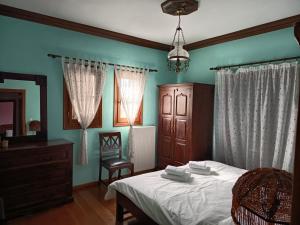 Postel nebo postele na pokoji v ubytování Lehonia Garden