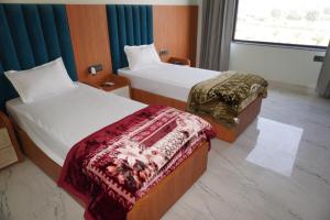 Ένα ή περισσότερα κρεβάτια σε δωμάτιο στο Hotel Highway Heaven +38 φωτογραφίες