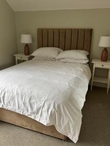 Voodi või voodid majutusasutuse Craigievar Cottage Skelmorlie toas