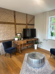 Et tv og/eller underholdning på Exklusive Unterkunft im Herzen der Altstadt