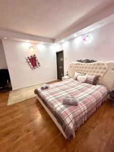 Postel nebo postele na pokoji v ubytování Simple and Cozy Room in Voluntari