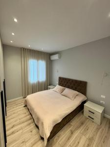 Ένα ή περισσότερα κρεβάτια σε δωμάτιο στο D&E Cozy Stay