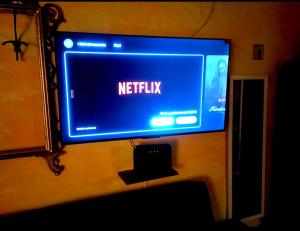 a sign that reads netflix hanging on a wall at The secret room in Pitigliano +16 photos