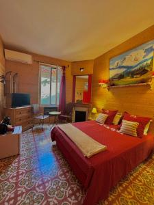 Μια τηλεόραση ή/και κέντρο ψυχαγωγίας στο Chambres d'Hôtes Le Mimosa