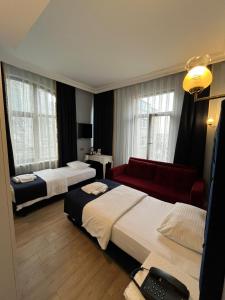 Ένα ή περισσότερα κρεβάτια σε δωμάτιο στο BOSS To HOTEL TAKSİM