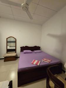 Ένα ή περισσότερα κρεβάτια σε δωμάτιο στο Sky Bloom Homagama