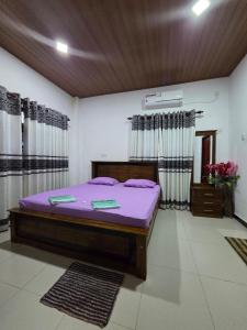 Ένα ή περισσότερα κρεβάτια σε δωμάτιο στο Sky Bloom Homagama