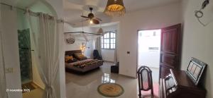 a living room with a couch and a bed at Casa Cesaria Guest House in Sal Rei