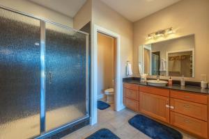 a bathroom with a shower and a sink and a toilet at Bluff View 30 Day in Hood River +19 photos