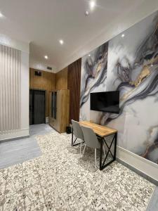 TV a/nebo společenská místnost v ubytování Viva Inn