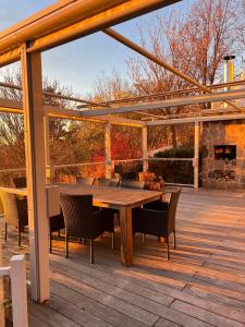 a wooden table and chairs on a wooden deck at Erfurt Haus Paradies in Erfurt