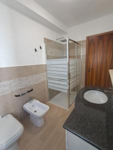 a bathroom with a sink and a toilet and a shower at Dimora Antico Forno 