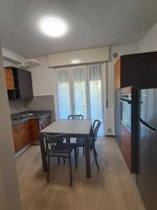 a kitchen with a table and chairs in a room at Dimora Antico Forno 