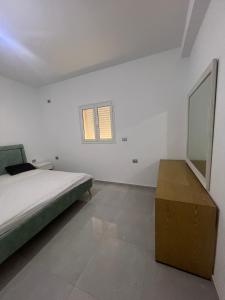 Ένα ή περισσότερα κρεβάτια σε δωμάτιο στο Dar anas