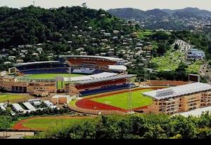 an aerial view of a baseball field with a stadium at Oceanview suites Very comfortable in Saint Georgeʼs