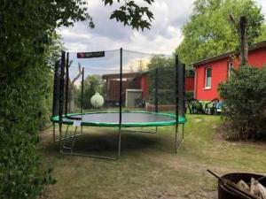 a trampoline in the yard of a house at Ferienhaeuser-Am-Eichenberg-Haus-1 in Blankenburg