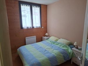 Postel nebo postele na pokoji v ubytování la cassine