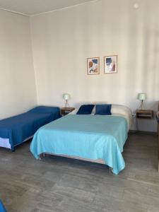 En eller flere senge i et værelse på Dpto pura vida 3