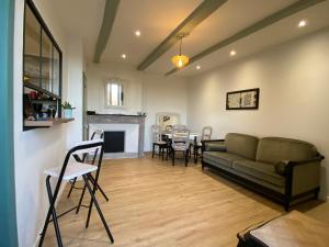 Posezení v ubytování Aux anciens remparts