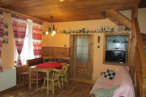 a living room with a table and a dining room at Chalupa u Jizery in Rokytnice nad Jizerou