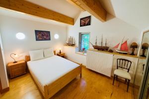 Ένα ή περισσότερα κρεβάτια σε δωμάτιο στο L'échappée belle - Maison entière - Marmagne