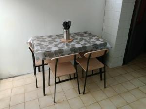 a table with a table cloth on it in a room at Les Galets in Fécamp +10 photos