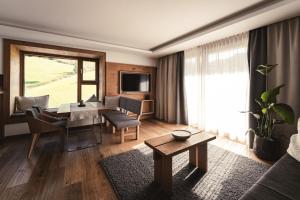 Un televizor și/sau centru de divertisment la Sunnsait - Appartements für Genießer