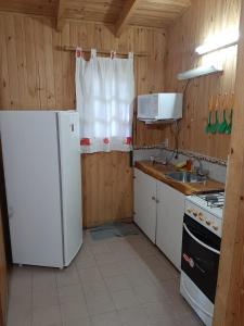 Køkken eller tekøkken på Complejo Del Bosque