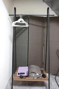 a closet with a bed with a bag on it at くつろぎのお宿 やわや 駅北 in Toyama