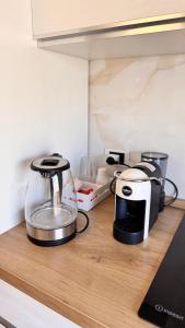 a kitchen counter with a blender and a toaster at Gioia's House in Montesilvano +36 photos