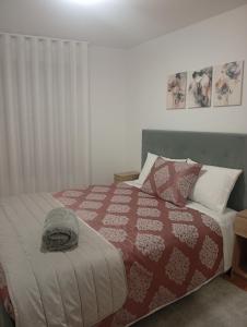 Ένα ή περισσότερα κρεβάτια σε δωμάτιο στο Refúgio Da Pinheira