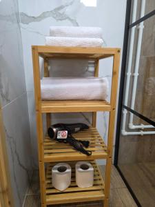 a wooden shelf with towels and a pair of scissors at Mountain Peace in Žabljak +17 photos
