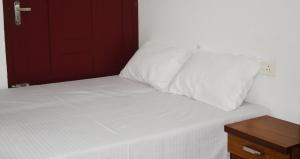 Postel nebo postele na pokoji v ubytování MeadowView Cottage Marari