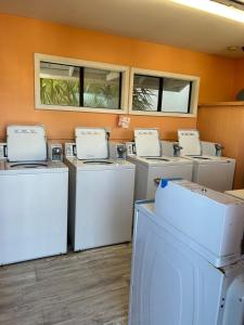 a row of washers and dryers in a room at Relax at the Beach in Myrtle Beach +21 photos